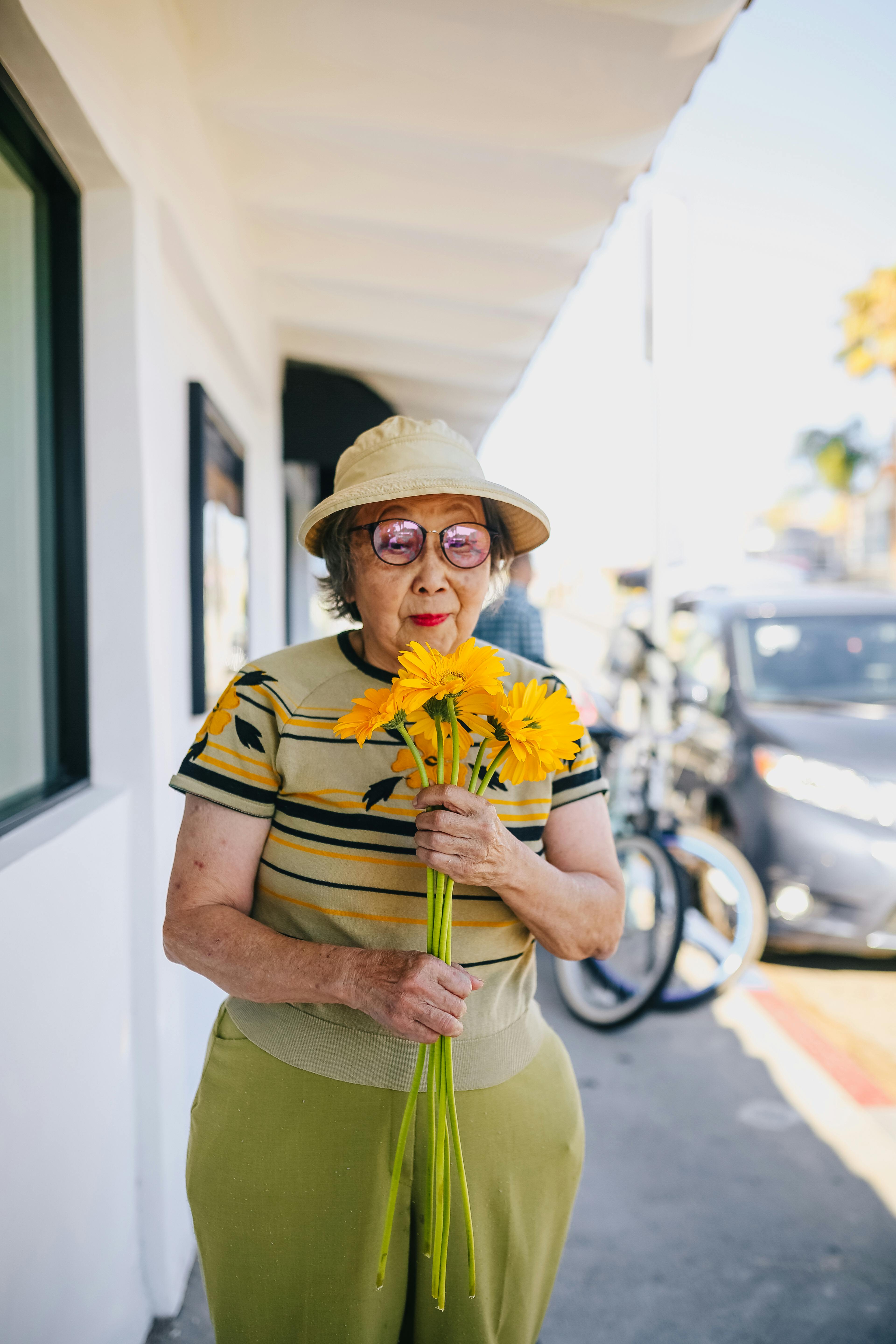 Woman holding sunflowers